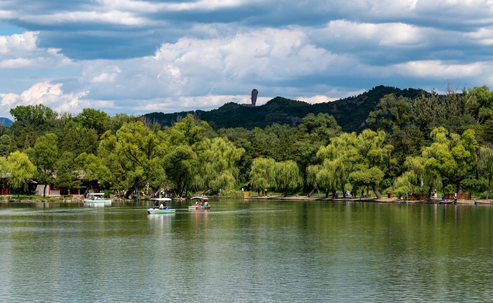 The lake district of the Chengde Mountain Resort with the hammer-shaped Qingchui peak on the ridge beyond